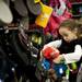 Five-year-old Reyanne Salameh plays with toy dolls at Nordstrom Rack on Tuesday, April 16. AnnArbor.com I Daniel Brenner